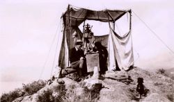 Lieutenants Charles Pierce and William Tucker checking the results of triangulation observations. Image