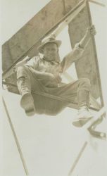 Floyd Risvold sitting on cross-member of Bilby Tower approximately 100 feet up Image