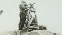 Setting up the theodolite to make observations. Image