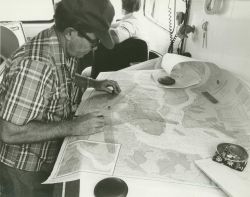 Personnel from NOAA's Atlantic Marine Center update the hydrography and evaluate sounding data on the nautical chart for the Cooper River. Image