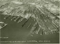 Aerial view of Communipaw, Jersey City, New Jersey showing rail lines, piers, and ferry terminal (at lower right of photo.) Image