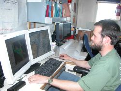 Processing hydrographic data on board the NOAA Ship RAINIER. Image