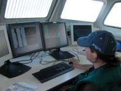 Monitoring both side scan and multi-beam data acquisition systems while doing launch hydrography off the NOAA Ship RAINIER. Image