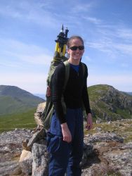 Ensign Patricia Raymond packing out tripod used for GPS antenna on Little Konuji . Image