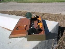 A heliotrope - an instrument used to reflect sunlight for signaling purposes and to extend range of visibility between points for survey purposes Image