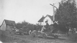 Level crew using motorized speeders on railroad. Image