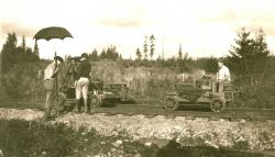 Level crew with party chief operating instrument. Image