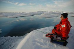 Sue Moore uses a hydrophone to listen for whales and other marine mammals. Image