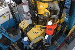 Sonsub technician preparing ROV for launch. Image