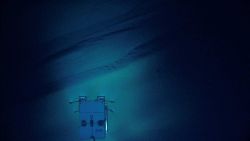 Deep Discoverer seen above sediment chutes along the flank of Bryant Canyon. Image