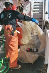 Washing the nets which pushes collected material into cod end of Tucker midwater plankton trawl. Image