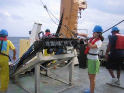 Estrella Malca gets tready to deploy the MOCNESS aboard the NOAA ship GORDON GUNTER. Image