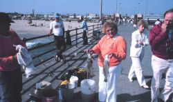 California pier angling - happy lady with a nice croaker catch. Image