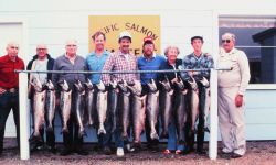 Charter vessel (CPFV) anglers displaying a good day's catch of salmon Image