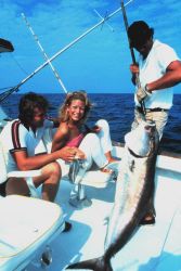Charter vessel anglers displaying large greater amberjack Image