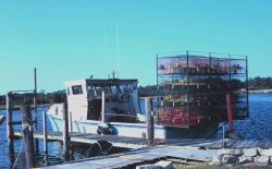 A blue crab fishing boat loaded with pots and ready to go to work. Image
