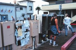 Pay phones on the docks were the primary means of saying goodbye or hello to family and friends with vessels coming and going Image
