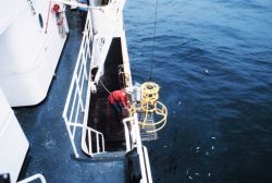 CTD rosette being deployed to study water temperature, salinity, and chemical characteristics Image