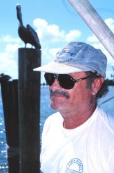 Profiles of two fishermen - Ted Esposito, a local charter boat skipper, and an unnamed pelican. Image