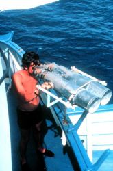 Spotter using large binoculars to look for signs of tuna. Image