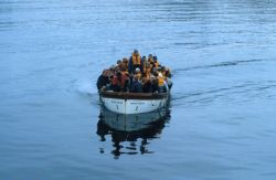 A R/V Profesor Siedlecki launch full of Polish scientists and sailors returns to the ship from a visit at the Polish Arctowski field station. Image