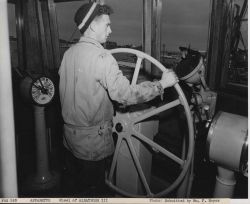 Fisherman Abel Medeiros at the wheel of the FWS ship ALBATROSS III. Image