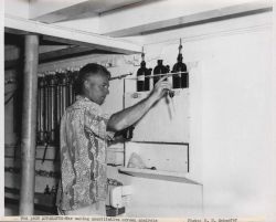 Scientist making quantitative oxygen analysis of sea water on board the Fisheries Research Vessel HUGH M Image