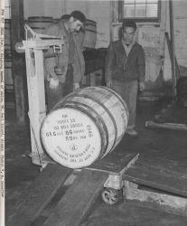 Weighing barrel of fur seal skins Image