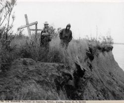 Albert Day, Director of the Fish and Wildlife Service on the left, at the Bethel cemetery. Image
