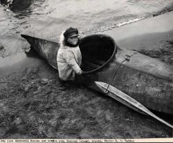 Eskimo child with bubble gum and kayak Image