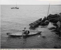 Eskimo departing Nunivak in kayak Image