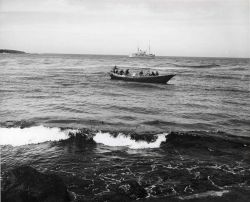 A bidarrah, a large Eskimo skin-covered boat, ferrying supplies from U.S Image