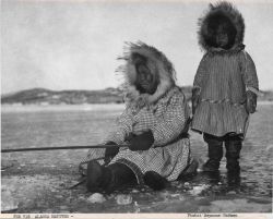 Alaska native eskimo woman and child ice fishing Image