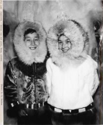 Eskimo boy and girl with fur-trimmed parkas. Image