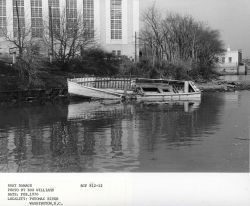 Derelict boat left to rot along the banks of the Potomac River. Image