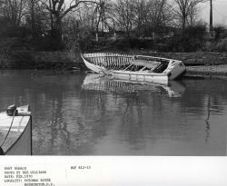 Derelict boat left to rot along the banks of the Potomac River. Image