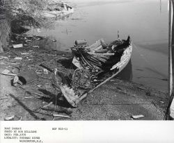 Derelict boat left to rot along the banks of the Potomac River. Image