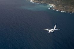 NOAA Twin Otter aircraft conducting marine mammal surveys off the Big Sur coastline. Image