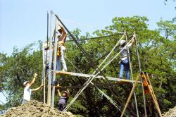 Attaching cross-ties to begin support for second thirteen-foot section of Bilby tower. Image