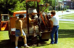 Mark truck with augur and cement mixer for digging holes and mixing and pouring concrete to set marks. Image