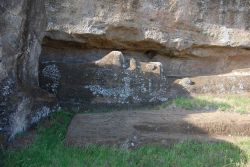 A reclining moai frozen in place in the Rano Raraku quarry. Image