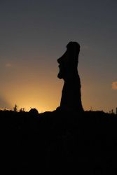 A moai silhouetted in one of the thousands of sunsets that have occurred since its being placed on the rocky shores of Easter Island. Image