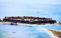 Aerial view of Fort Jefferson with NOAA Ship FERREL anchored offshore in background. Image