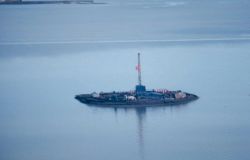 An offshore oil rig on an artificial island. Image