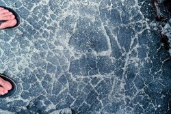 Natural petroglyphs - apparently filling and natural cementing of cracks in basalt. Image