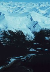 Snow-covered mountains and a retreating glacier to the east of Stephens Passage Image