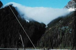 Fog tumbling through a break in the mountains at Prince William Sound Image