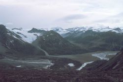 Mountains, glacial valleys, and a river valley on a gray day in Redoubt Volcano area. Image