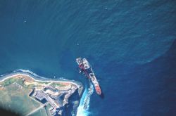 A grounded Russian merchant vessel off the El Morro at the entrance to San Juan Harbor. Image