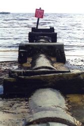 An outfall pipe entering the Gulf of Mexico. Image